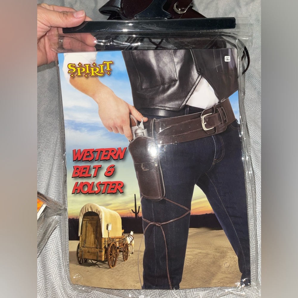 Cowboy belt with holster and gun